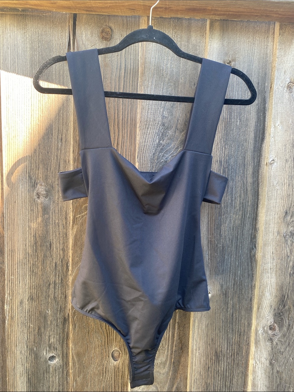 Free People BNWT Oh She’s So Strappy 
Sleek Black One-Piece Bodysuit